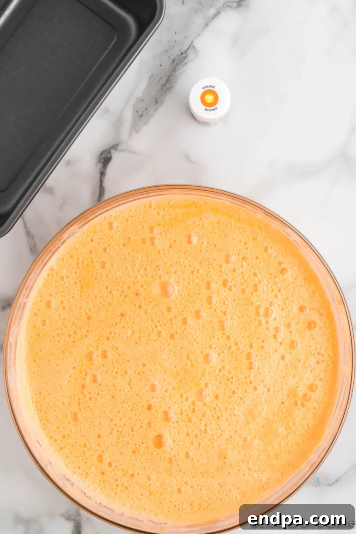 Sunset Swirl 5 Large bowl now contains orange soda mixed with sweetened condensed milk, showing a vibrant orange liquid.