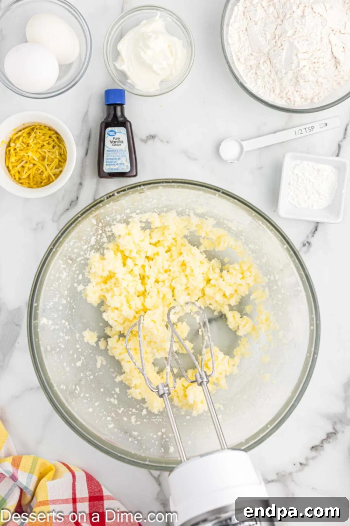 Zesty Lemon Raspberry Cupcakes 4 Mixing bowl with butter and sugar.