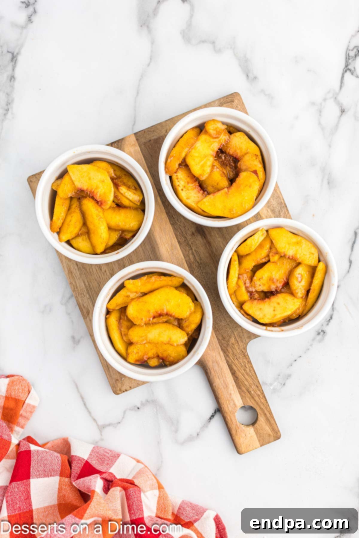 Dividing the peach mixture in ramekins