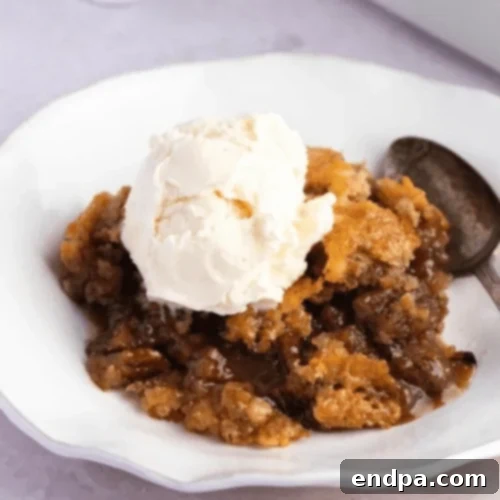Ultimate Cobbler Collection 5 Pecan Pie Cobbler with a golden topping, served warm.