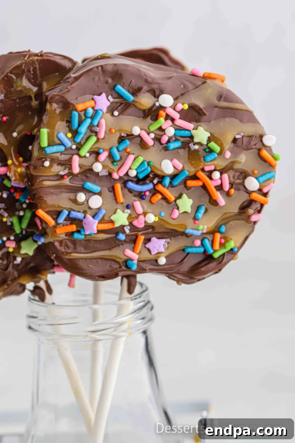 Caramel Apple Slice with sprinkles in a jar standing up.