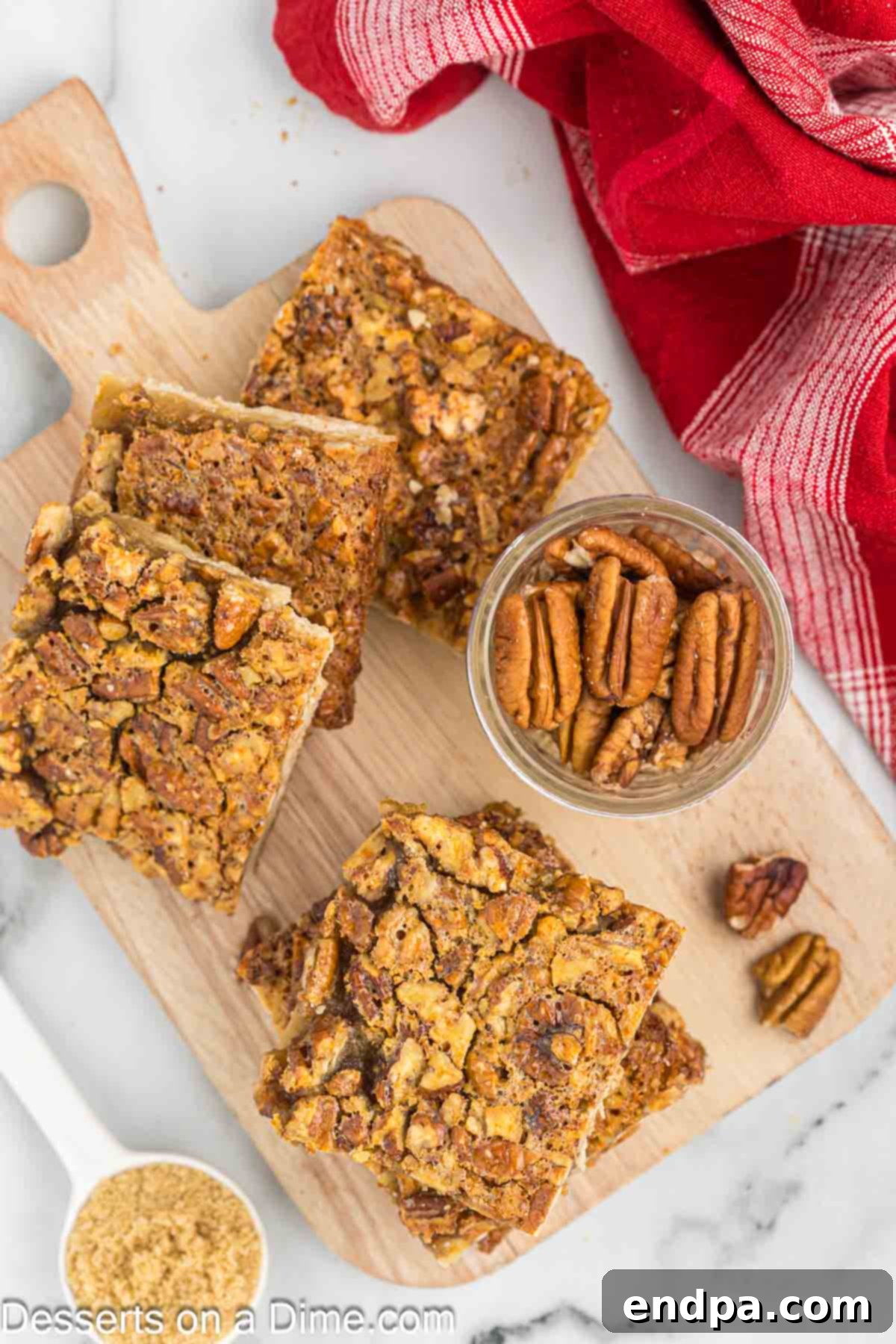 Beautifully baked pecan pie bars, cooled and neatly sliced into individual portions, ready for serving.