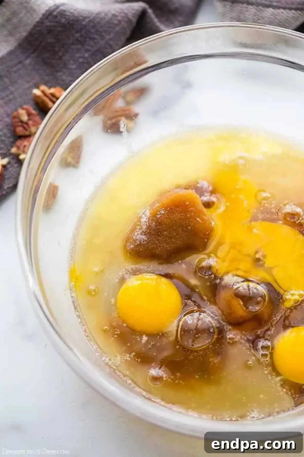 Mixing bowl with brown sugar and egg mixture. 