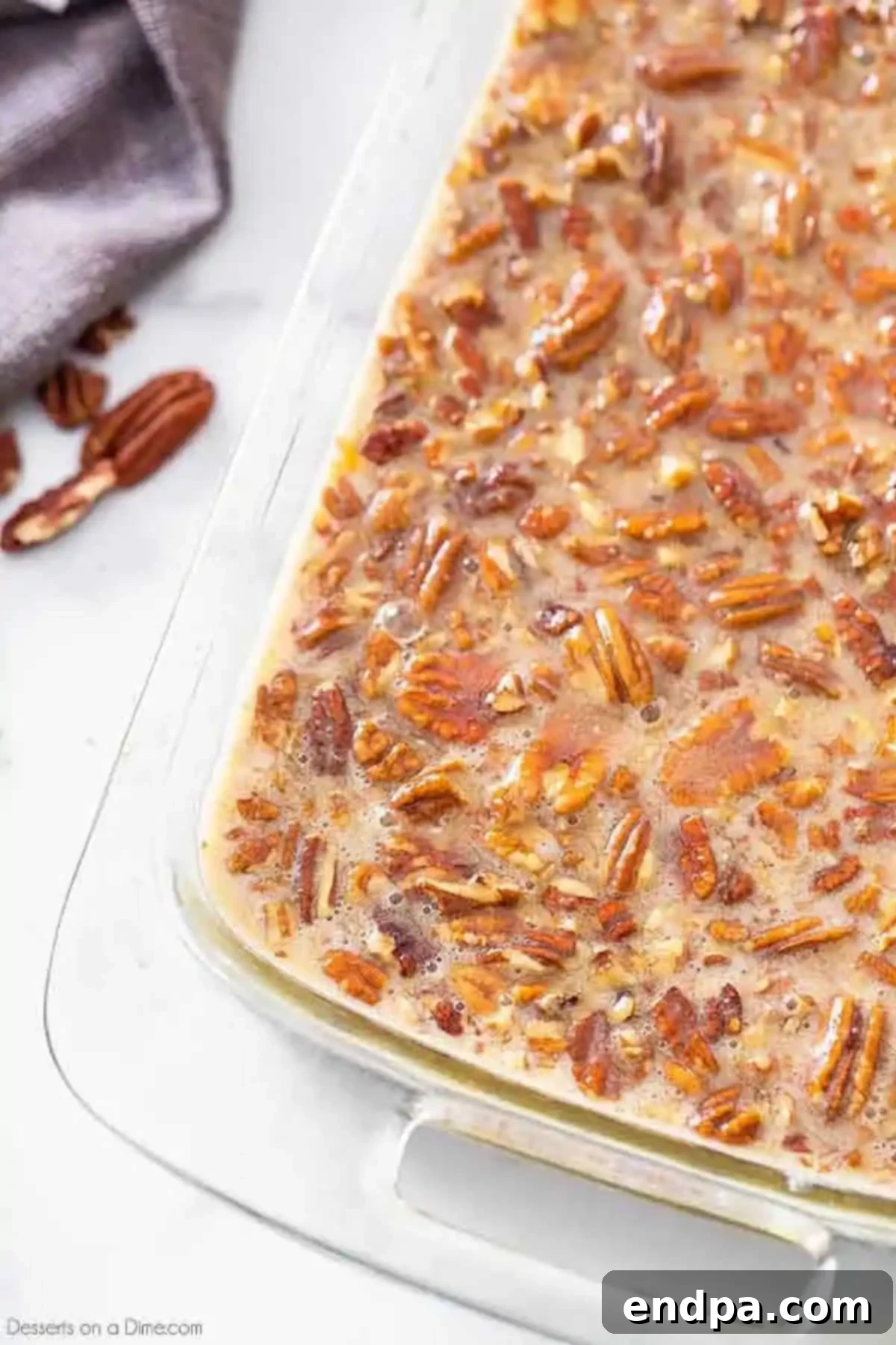 Pecan pie filling spread over brownie batter. 