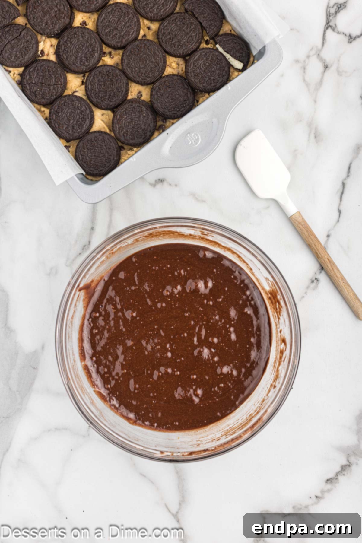 Mixing bowl containing freshly prepared brownie batter, smooth and ready to be poured.