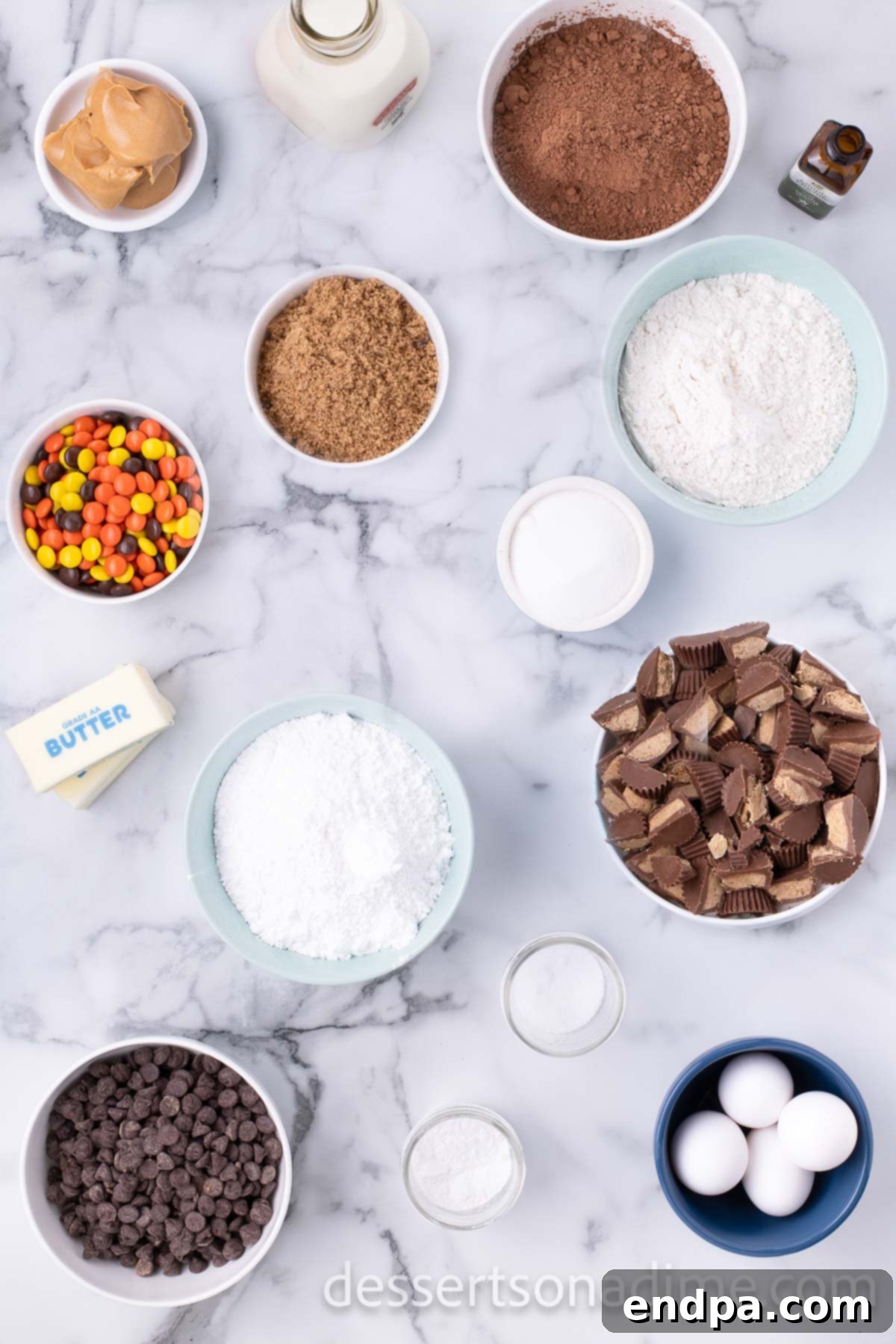 Decadent Reese's Peanut Butter Brownies 3 Ingredients for brownies including sugar, cocoa powder, flour, butter, vanilla, chocolate chips, peanut butter, peanut butter cups, and Reese's Pieces.