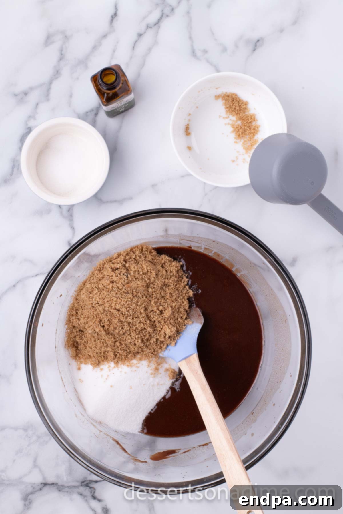 Decadent Reese's Peanut Butter Brownies 6 Dry ingredients being added to the chocolate mixture for brownies.