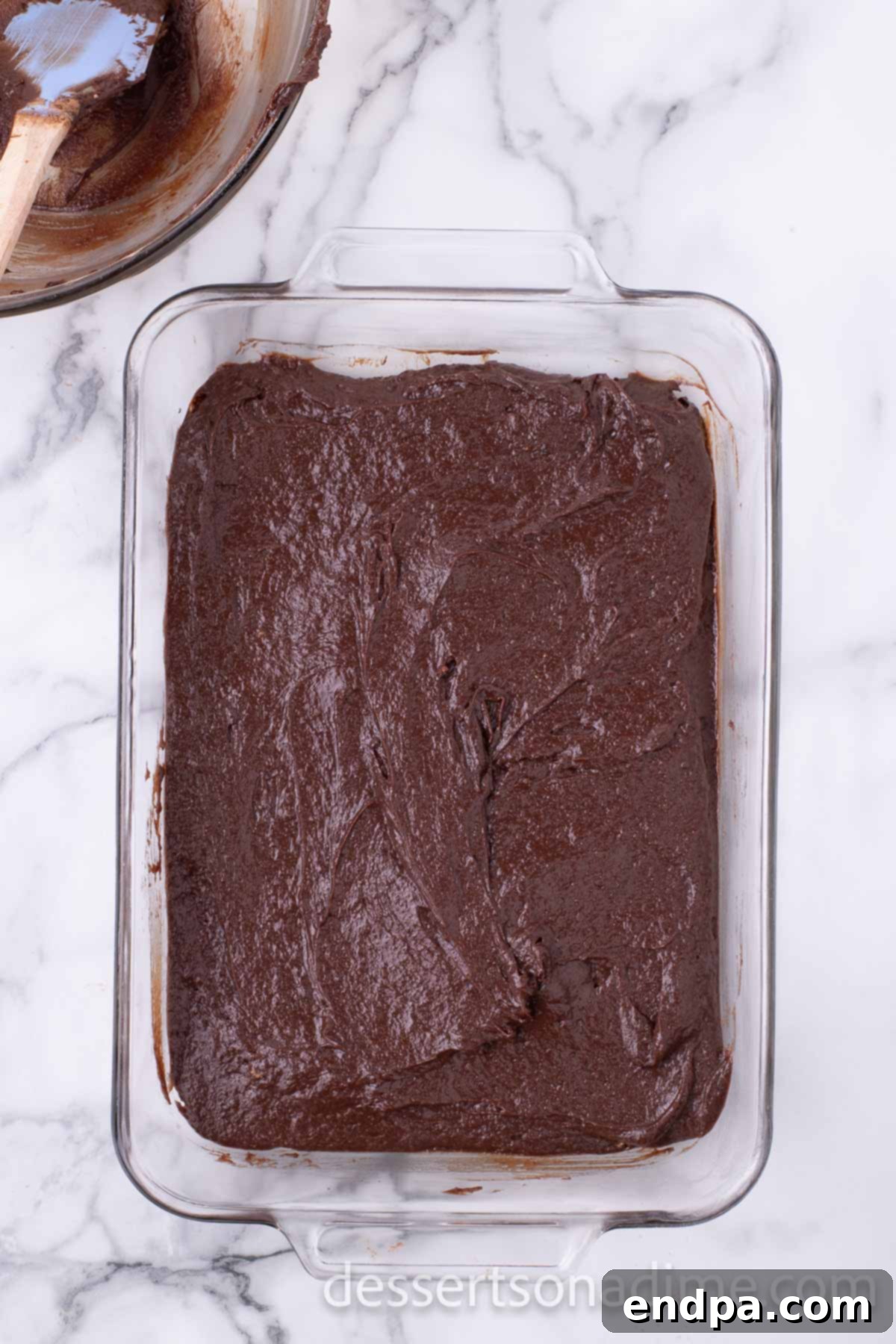 Decadent Reese's Peanut Butter Brownies 7 Brownie batter spread evenly into a baking pan.