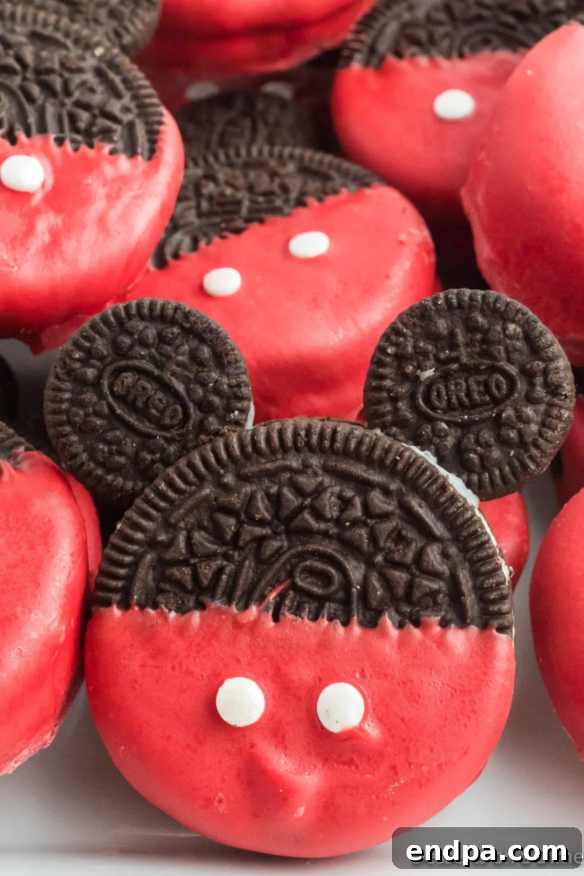 Mickey's Magical Oreo Treats 10 A close-up shot of a pile of freshly made Mickey Mouse Oreo Cookies, showcasing their adorable design and tempting appeal, ready to be enjoyed or shared.