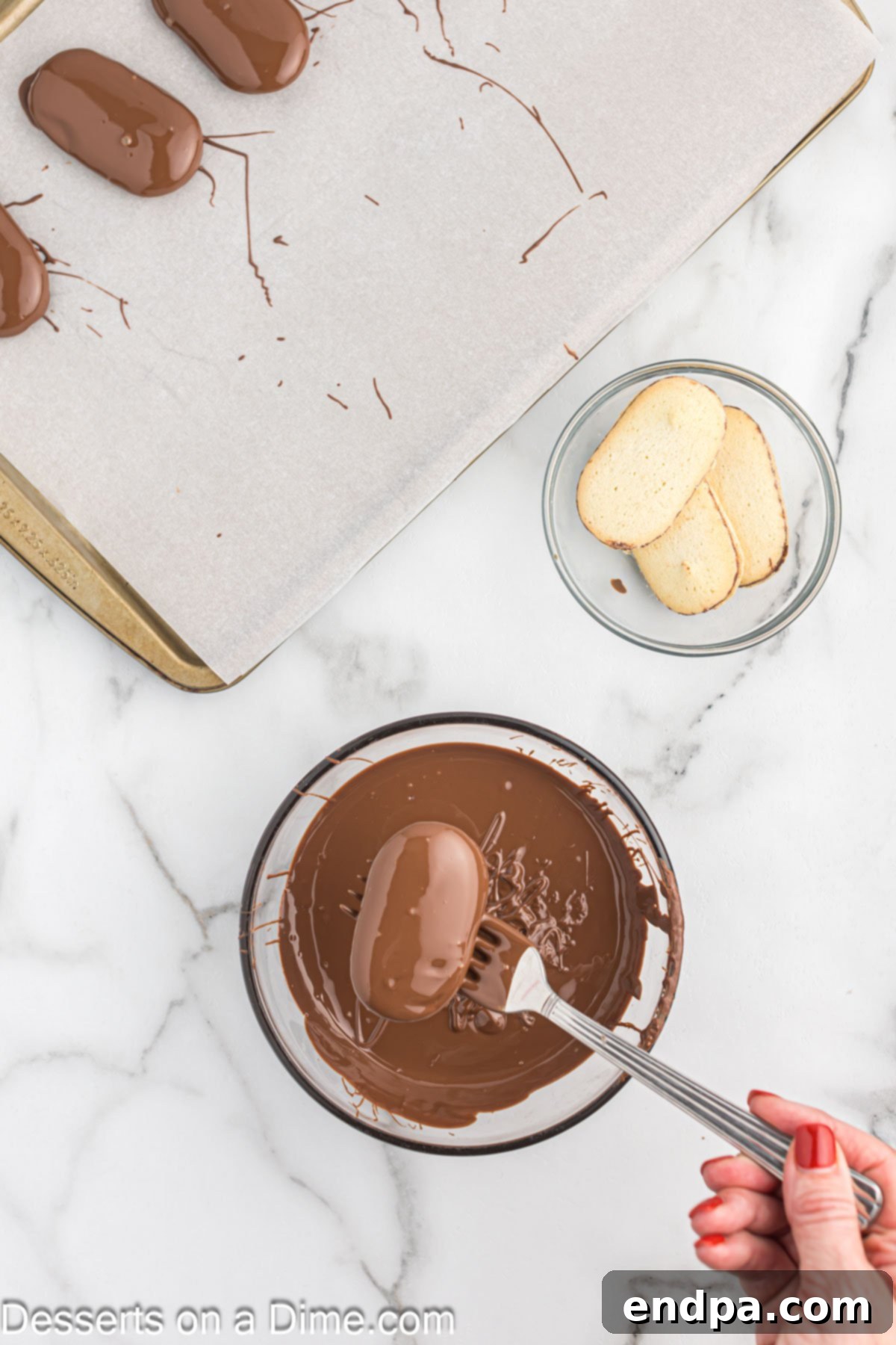 Bowl of melted chocolate with cookie being dipped.
