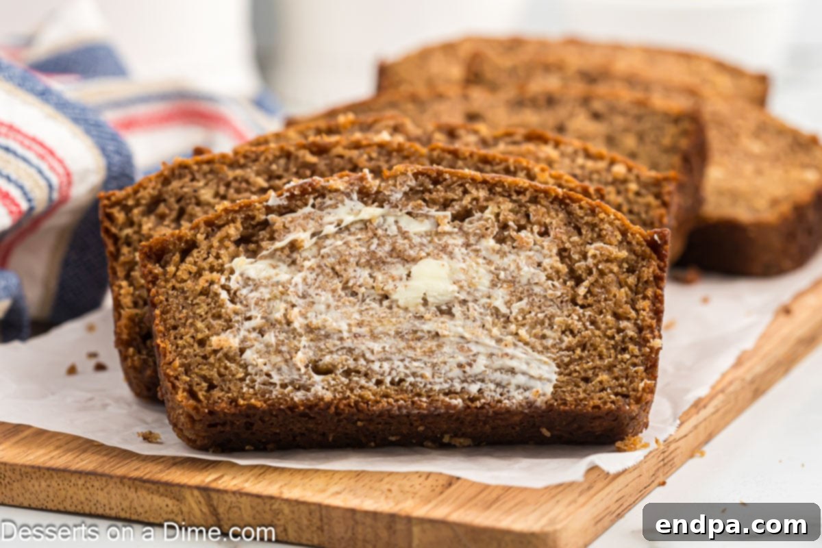 Sliced applesauce bread with butter.