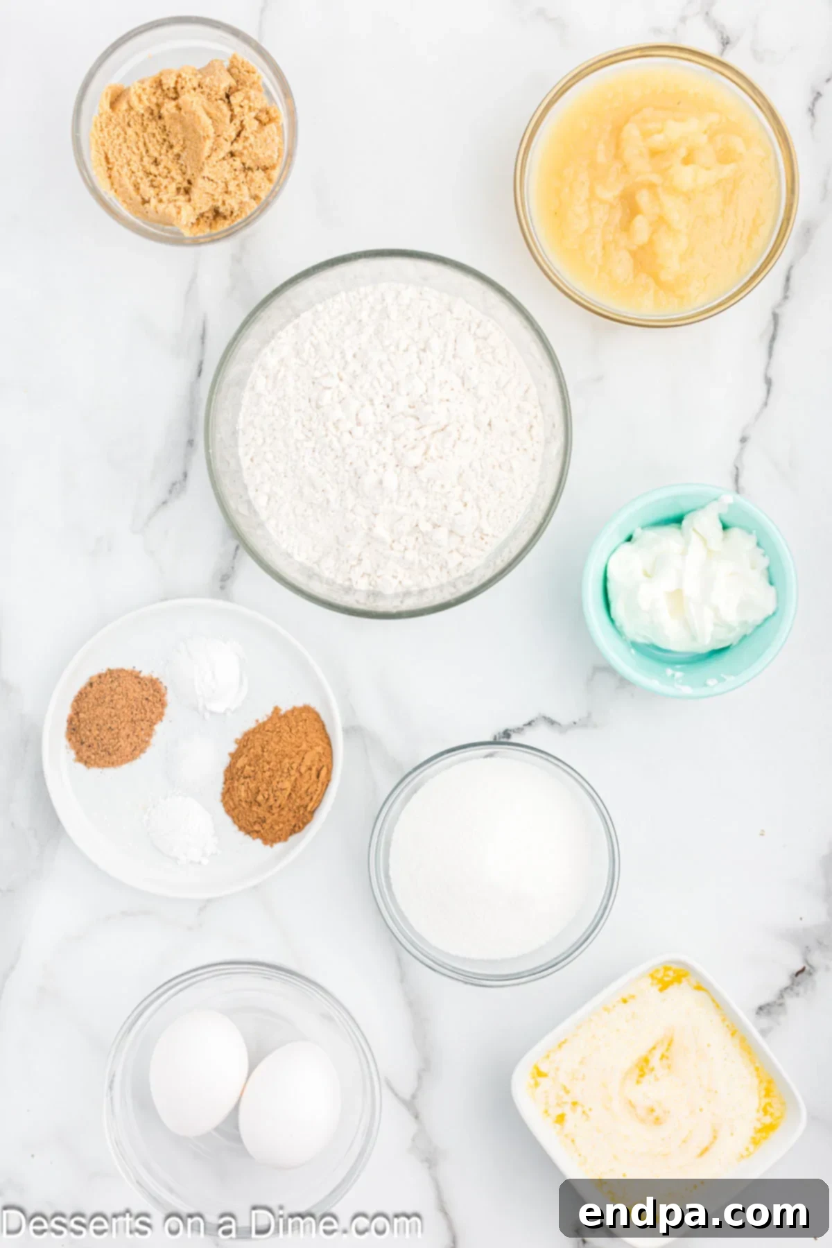 Ingredients for applesauce bread: butter, sugar, applesauce, Greek yogurt, flour, cinnamon.