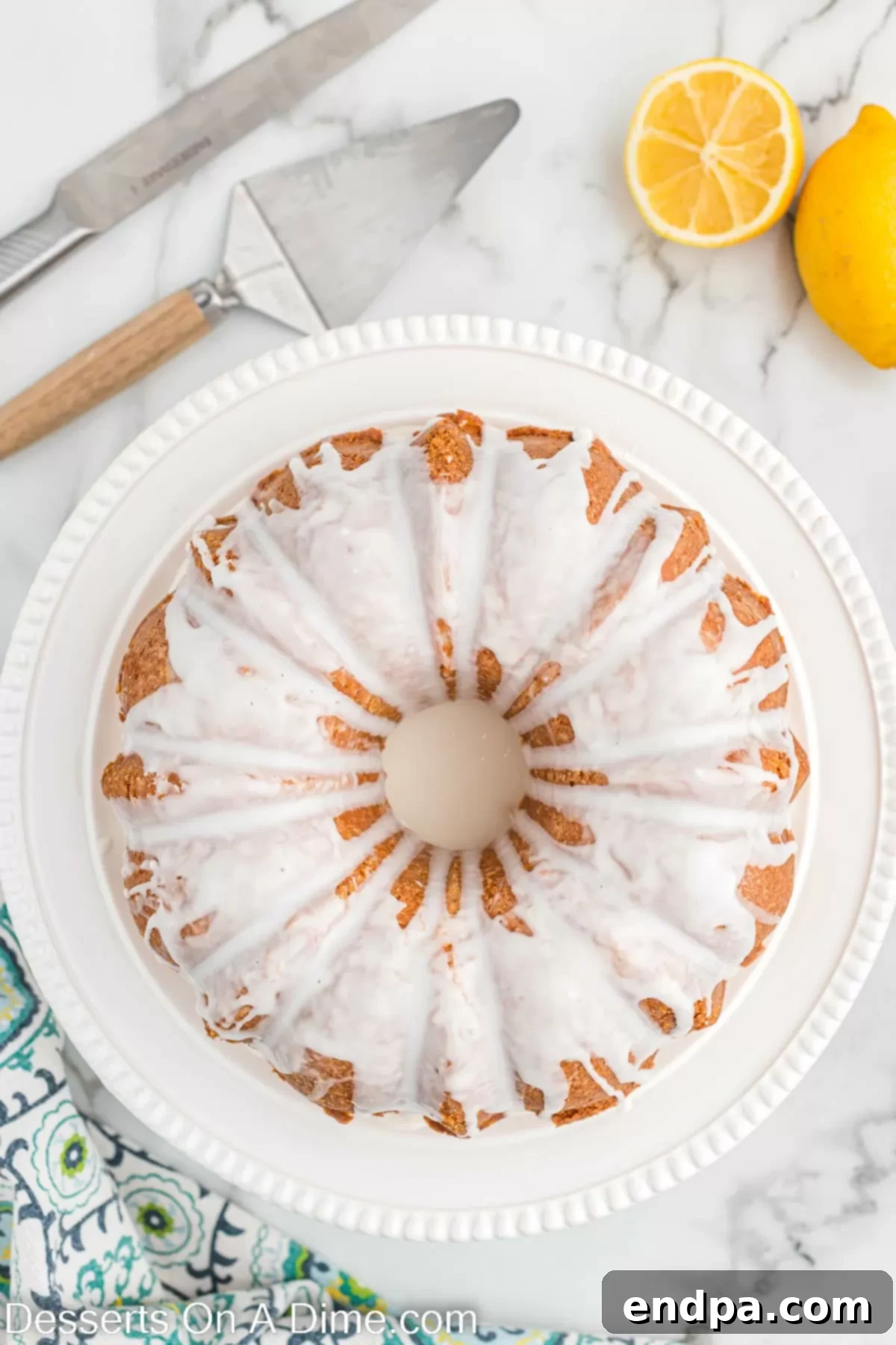 How to Freeze Pound Cake Perfectly 3 A beautifully sliced pound cake, showcasing its dense texture, on a white serving platter.