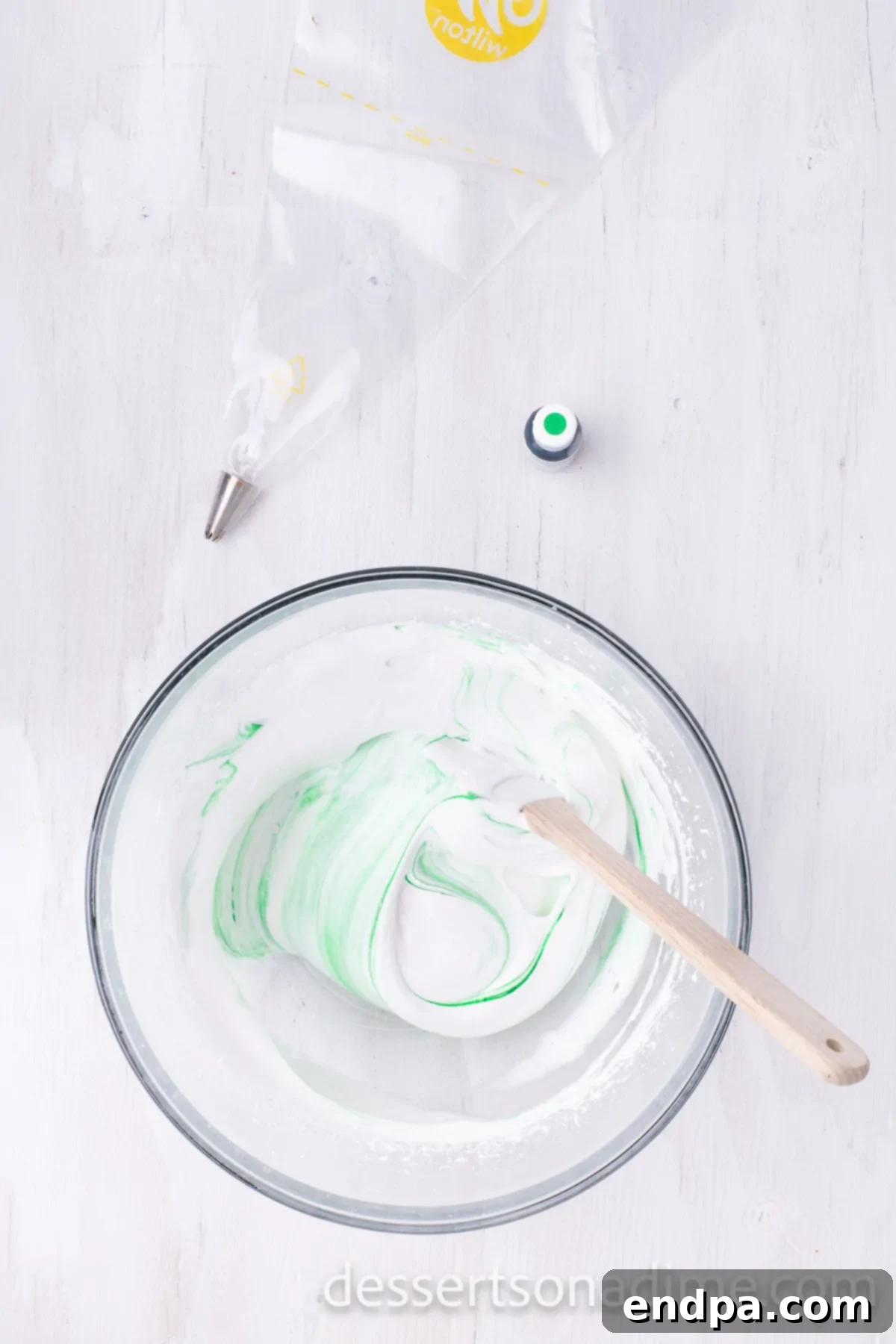 Festive Meringue Christmas Trees 7 Green food coloring in bowl.