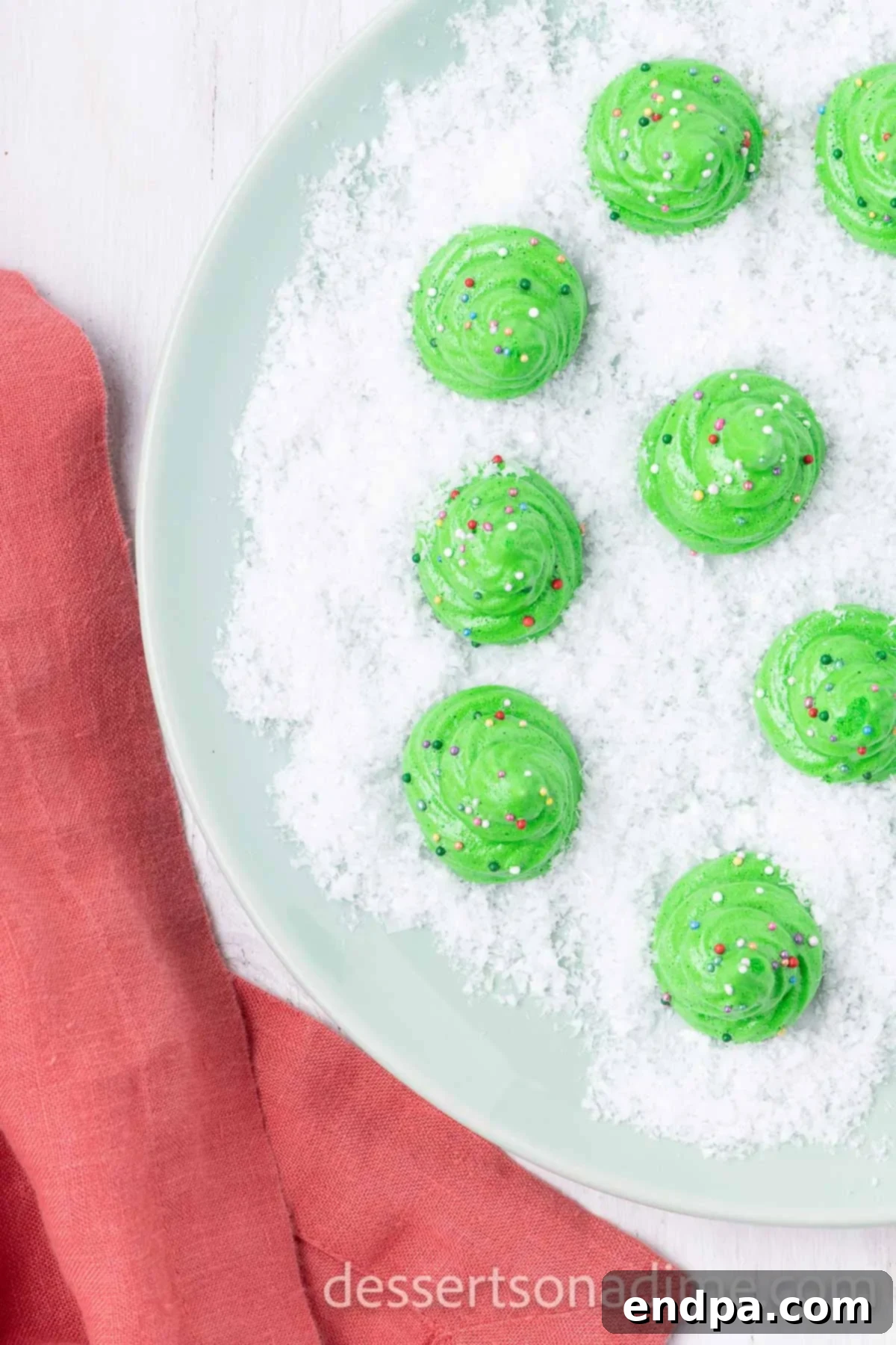 Festive Meringue Christmas Trees 9 Cookies on a serving platter ready to enjoy.