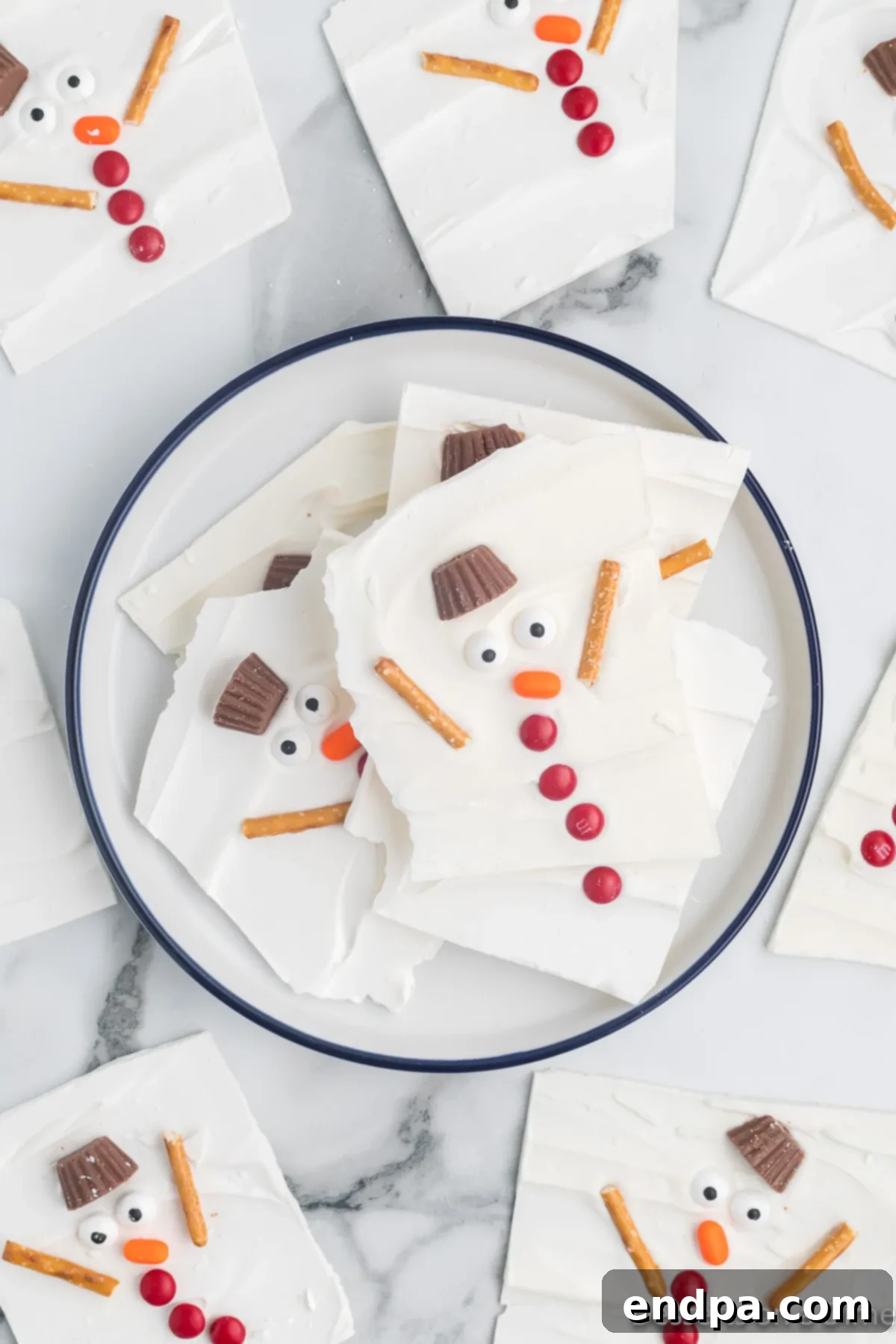 Frosty Meltdown Bark 12 Melted Snowman Bark broken into pieces and stored in a festive bowl, ready for enjoyment.