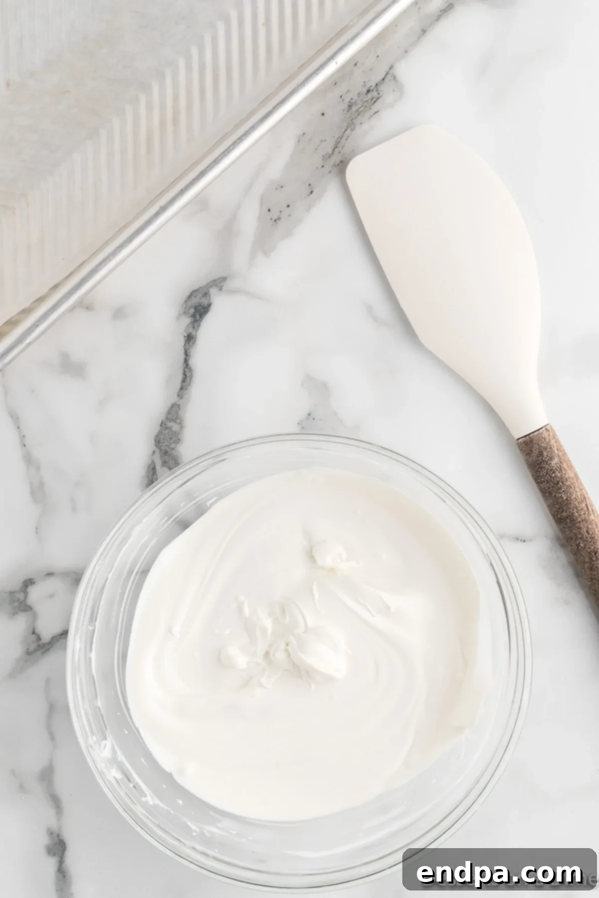 Frosty Meltdown Bark 4 Bowl with melted white chocolate, smooth and ready to be spread.