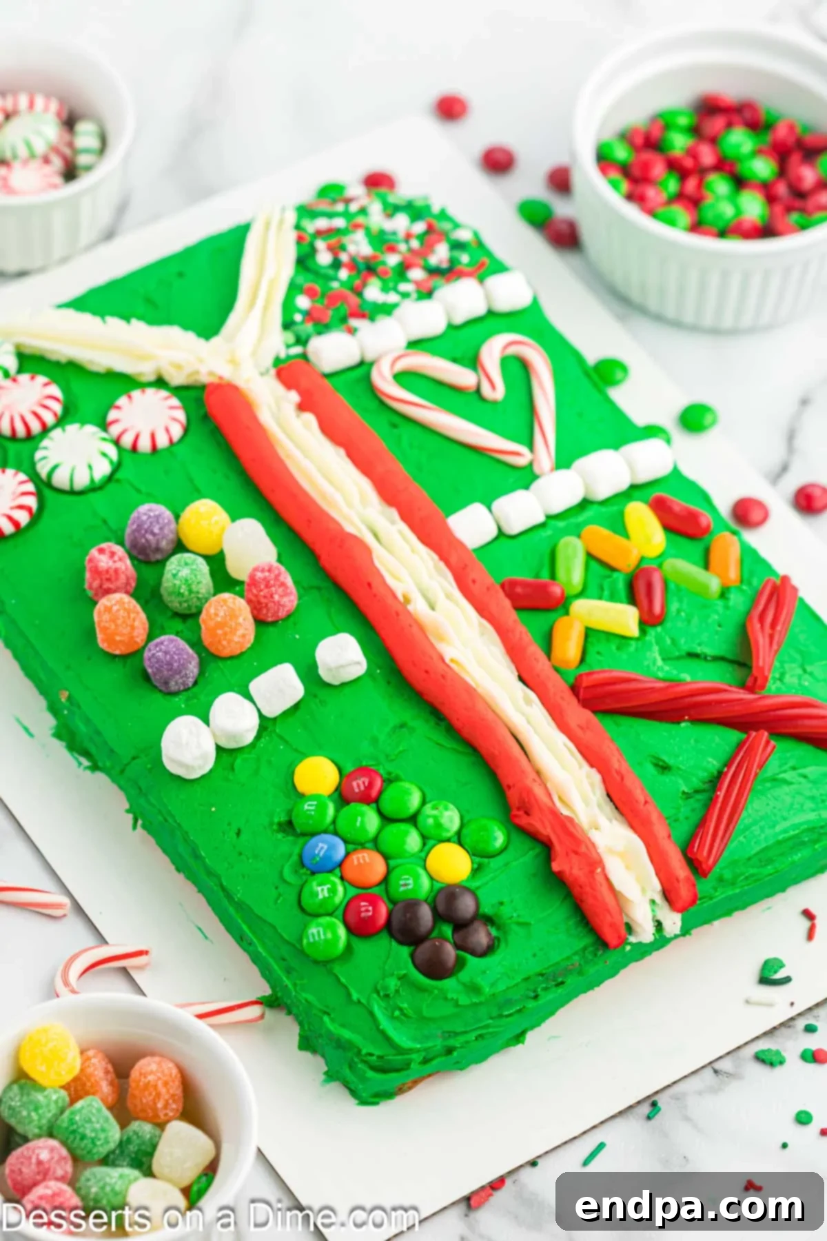 Gaudiest Garment Bake 12 The final Ugly Sweater Cake ready to be served on a platter, showcasing all its festive details.