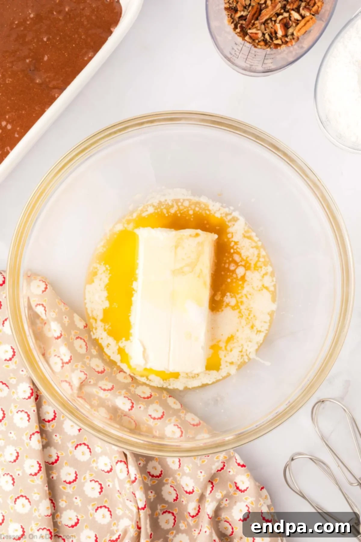 One-Pan German Chocolate Cake 6 Softened cream cheese in a mixing bowl with vanilla extract.