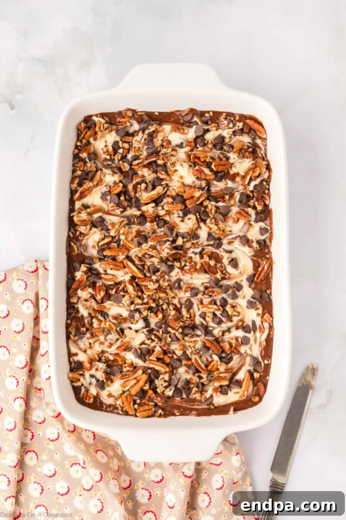 One-Pan German Chocolate Cake 10 Additional chocolate chips and pecans sprinkled on top of the dolloped cream cheese mixture.