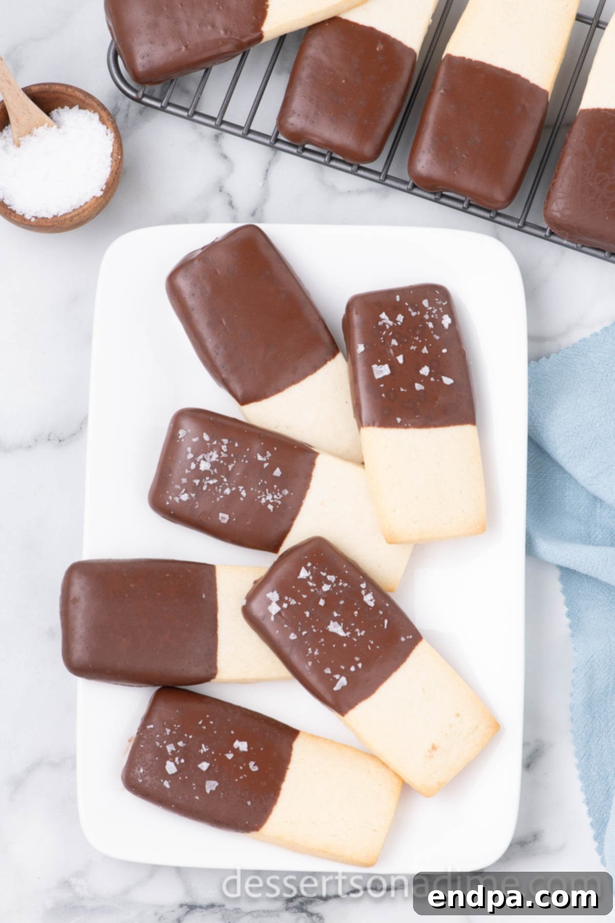 A platter of beautifully arranged Chocolate Dipped Shortbread Cookies, ready to be enjoyed.