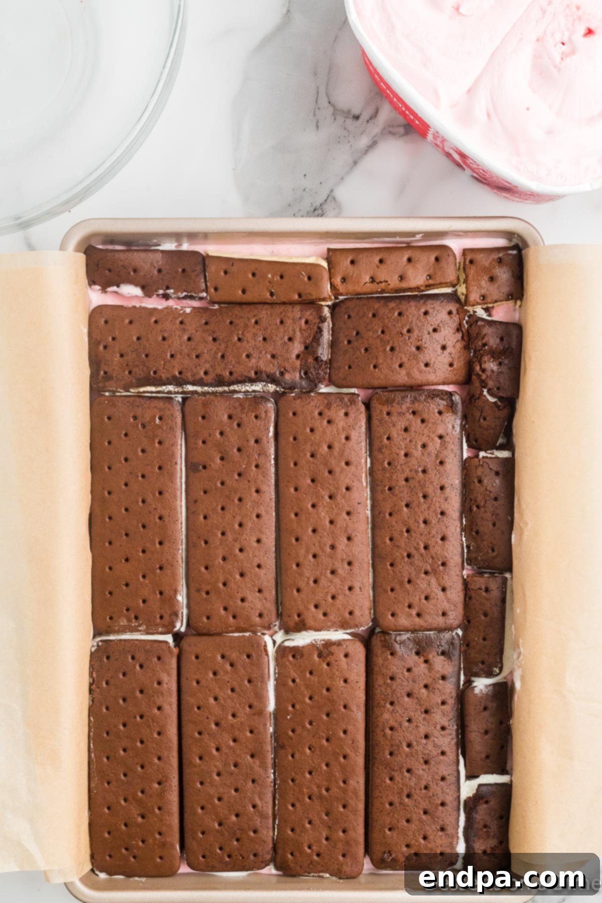 Holly Jolly Ice Cream Cake 8 Ice cream sandwiches layered over the first ice cream layer.