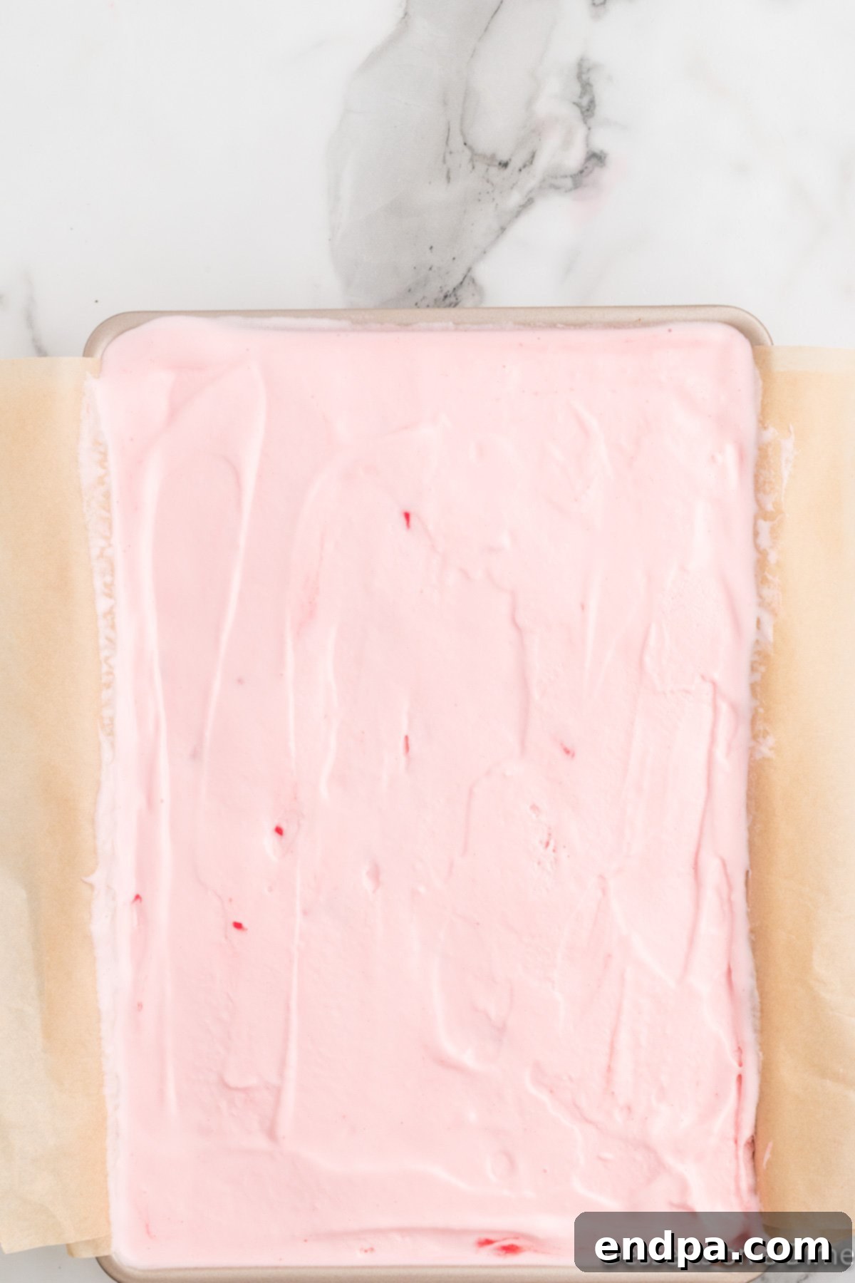 Holly Jolly Ice Cream Cake 9 Final layer of peppermint ice cream spread smoothly over the ice cream sandwiches.