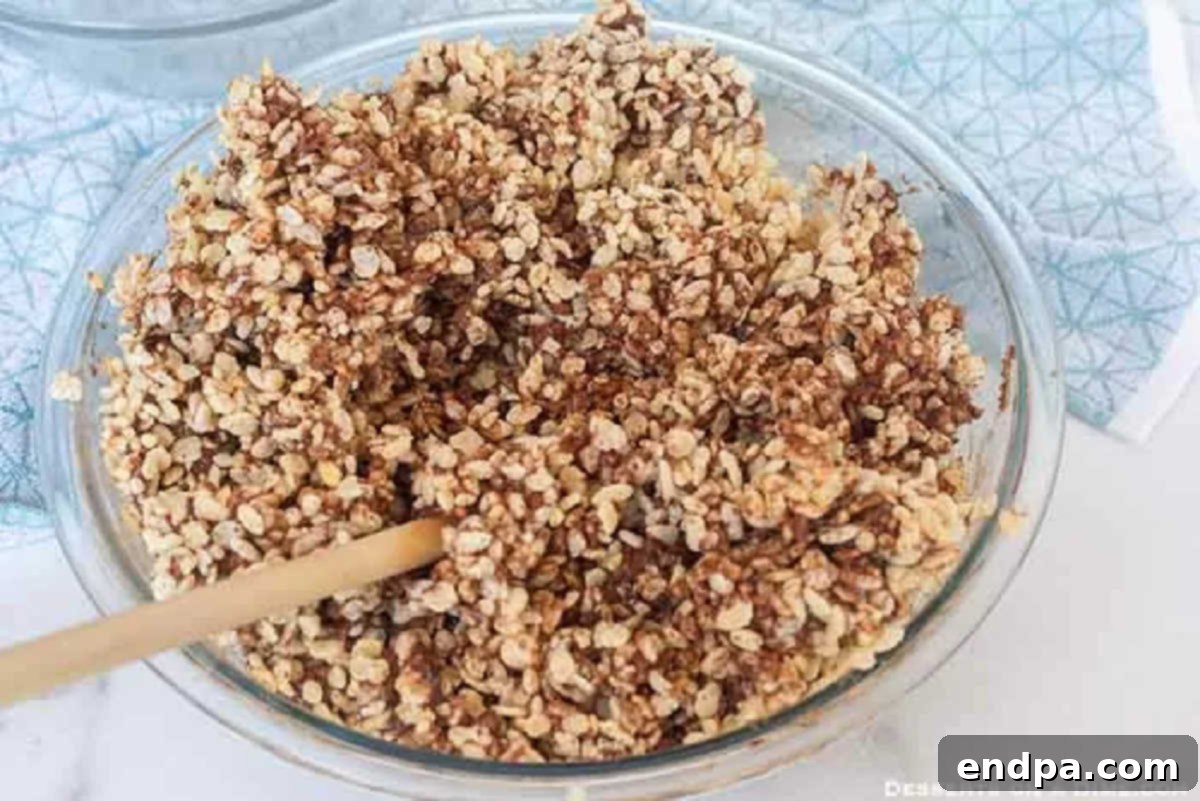 Crispy rice cereal fully combined with the chocolate mixture.