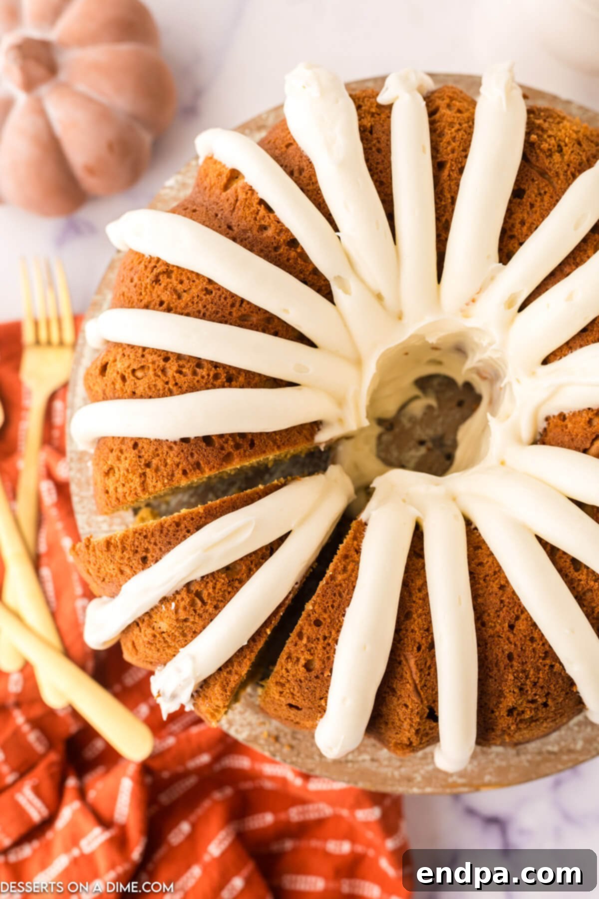 Bundt Cake topped with cream cheese frosting, ready to be served.