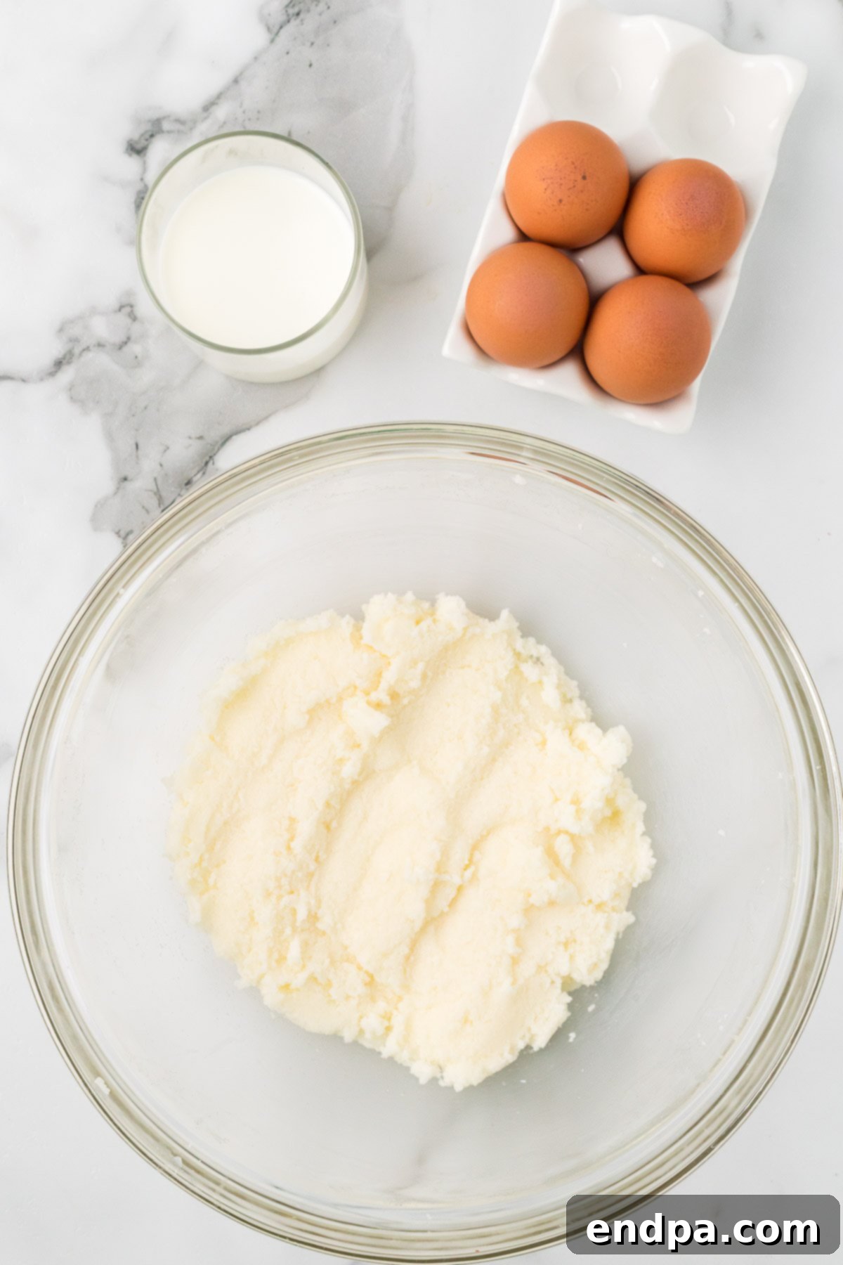 Mixing bowl of butter and sugar combined.