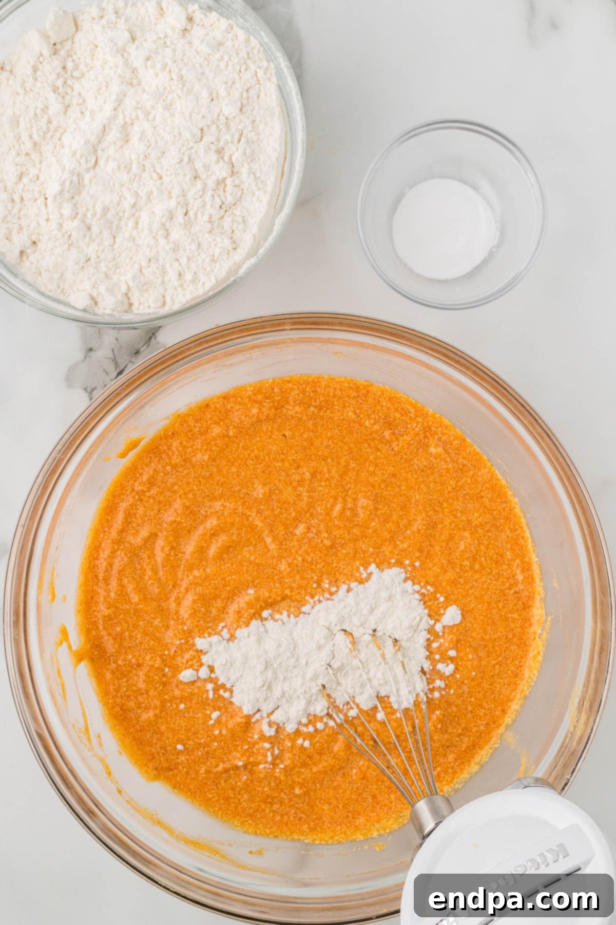 Flour slowly added to pumpkin mixture.