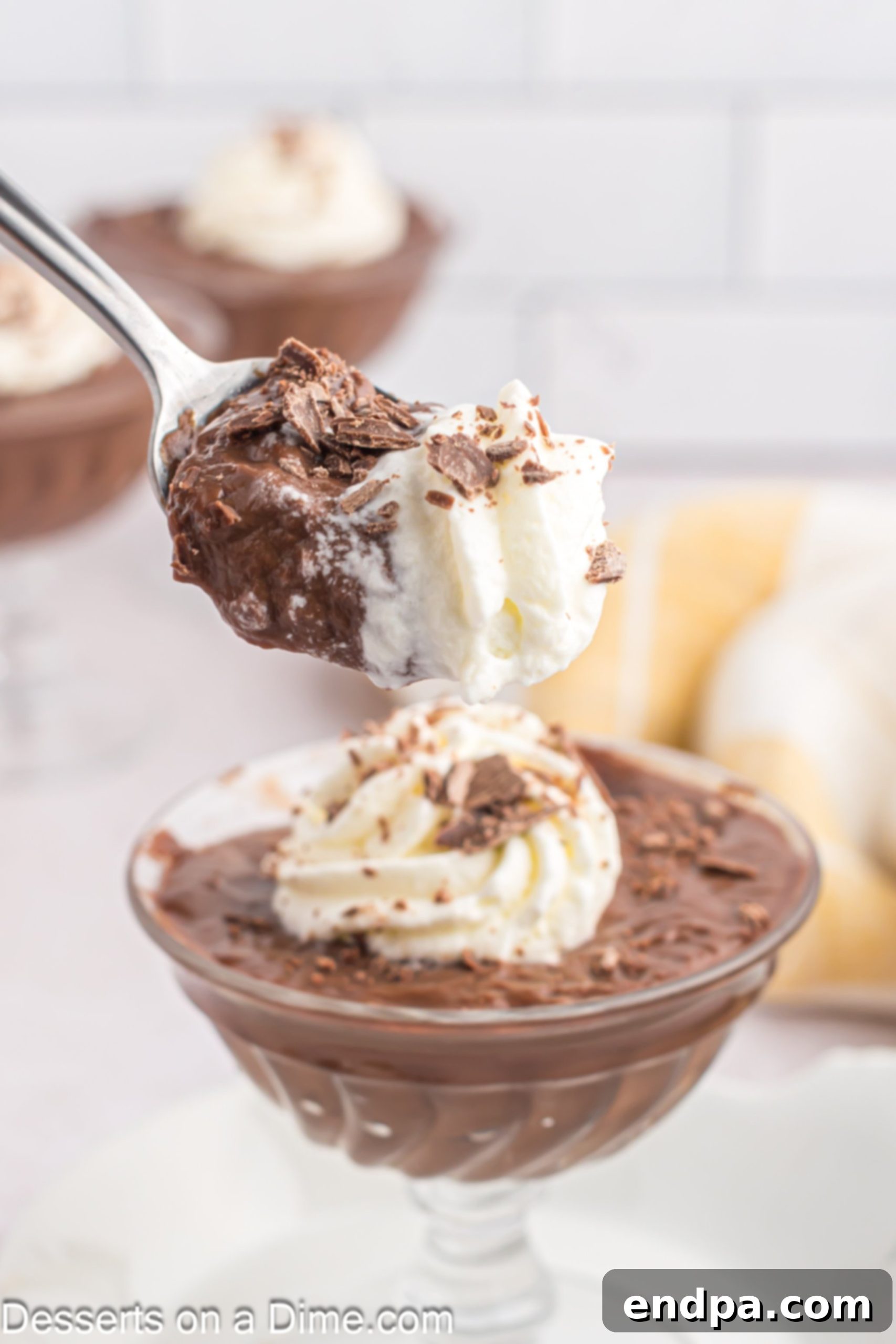 Decadent Chocolate Dream 2 Rich homemade chocolate pudding served in a clear bowl, ready to be enjoyed.
