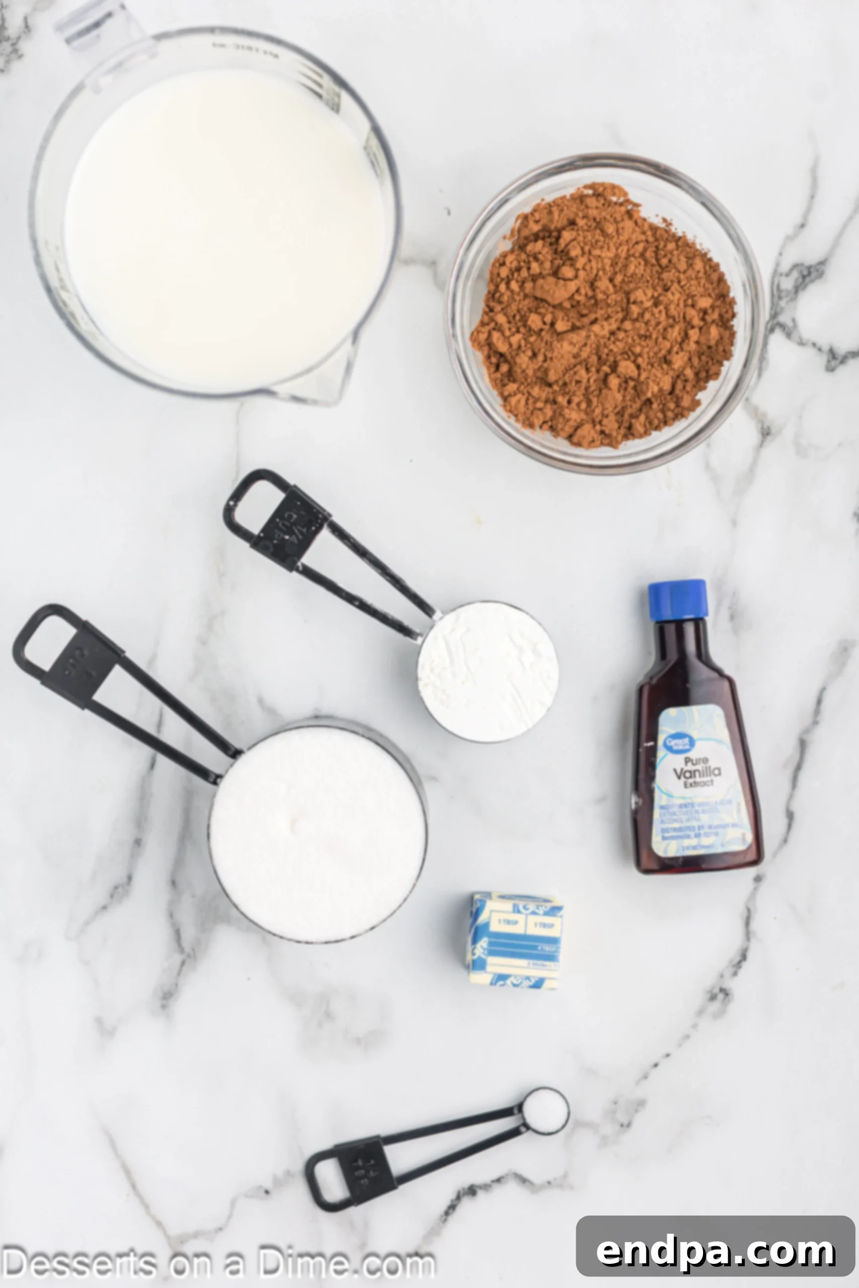 Decadent Chocolate Dream 3 Key ingredients for homemade chocolate pudding: granulated sugar, cocoa powder, cornstarch, salt, and milk, arranged on a rustic surface.