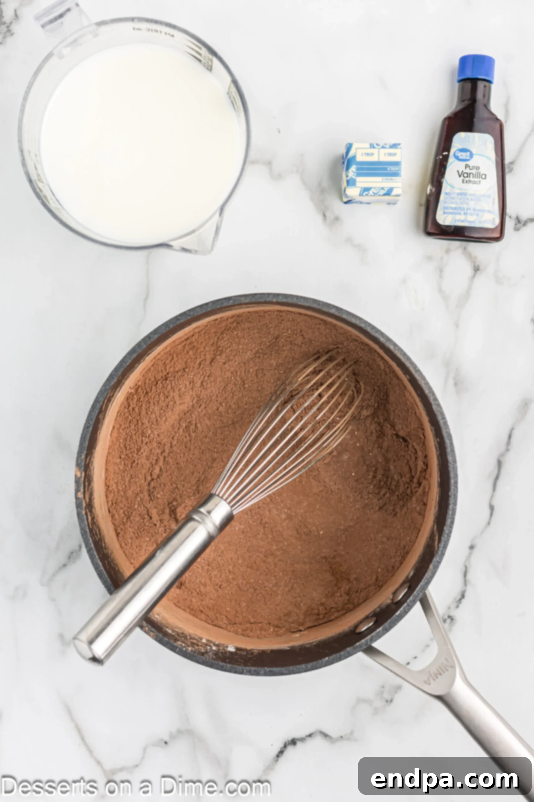 Decadent Chocolate Dream 4 Saucepan containing mixed dry ingredients for chocolate pudding: sugar, cocoa powder, and cornstarch.