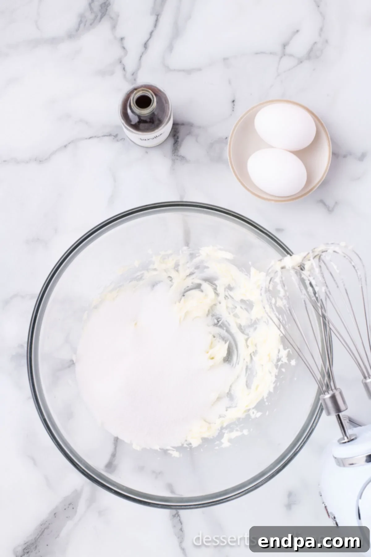 Homemade Sweet-Tart Cranberry Loaf 5 Softened butter and granulated sugar being creamed together in a large mixing bowl with an electric mixer.