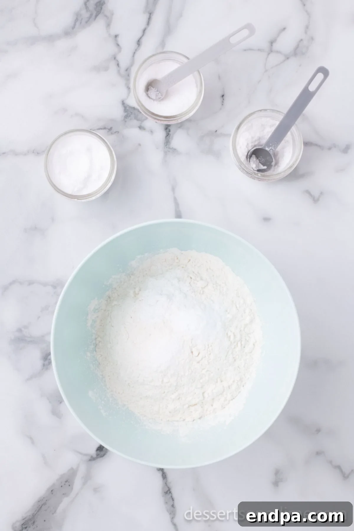 Homemade Sweet-Tart Cranberry Loaf 6 A separate bowl containing dry ingredients – flour, baking powder, baking soda, and salt – meticulously combined.