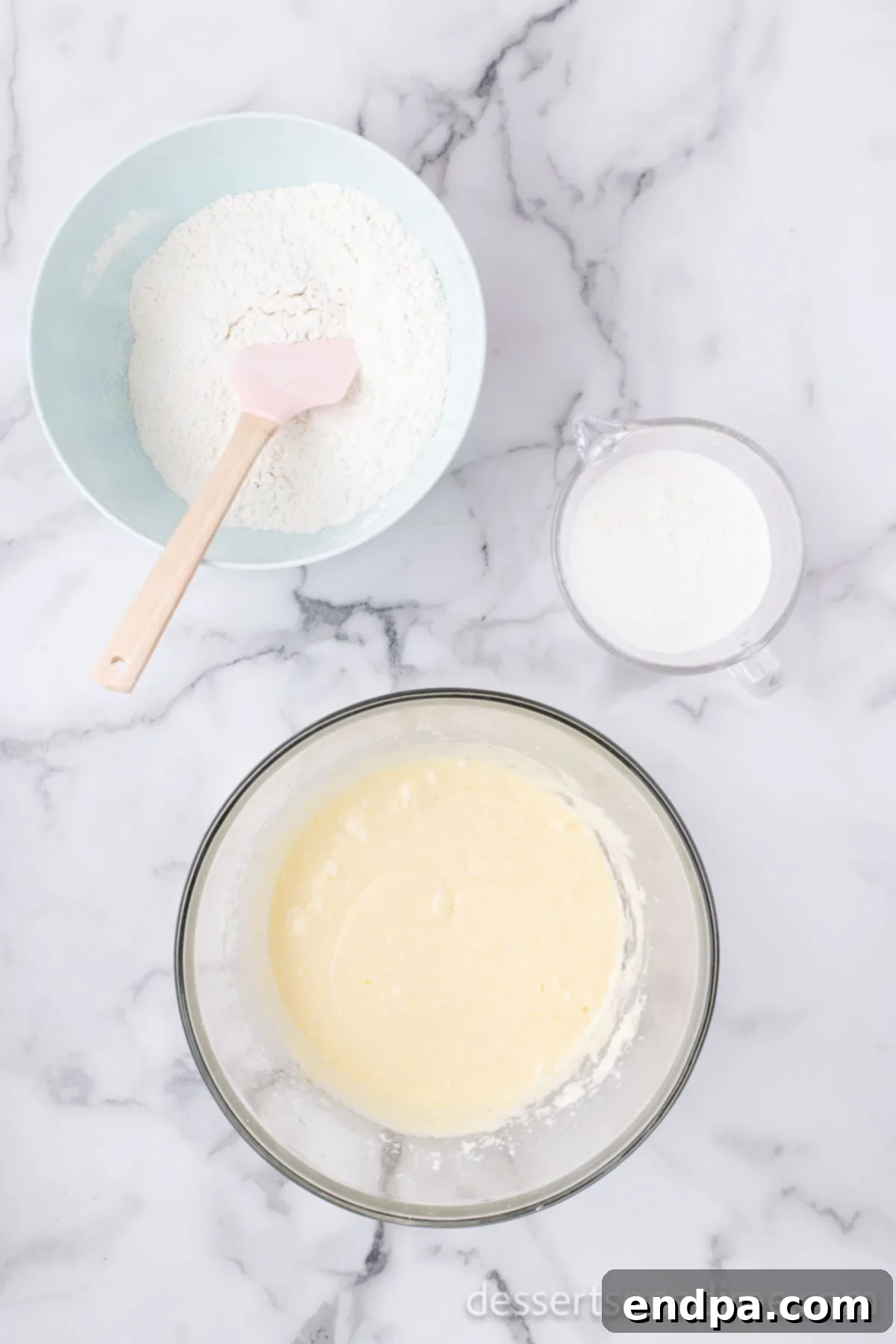 Homemade Sweet-Tart Cranberry Loaf 7 The combined dry ingredients being gradually stirred into the wet butter mixture in a large bowl, alternating with milk.