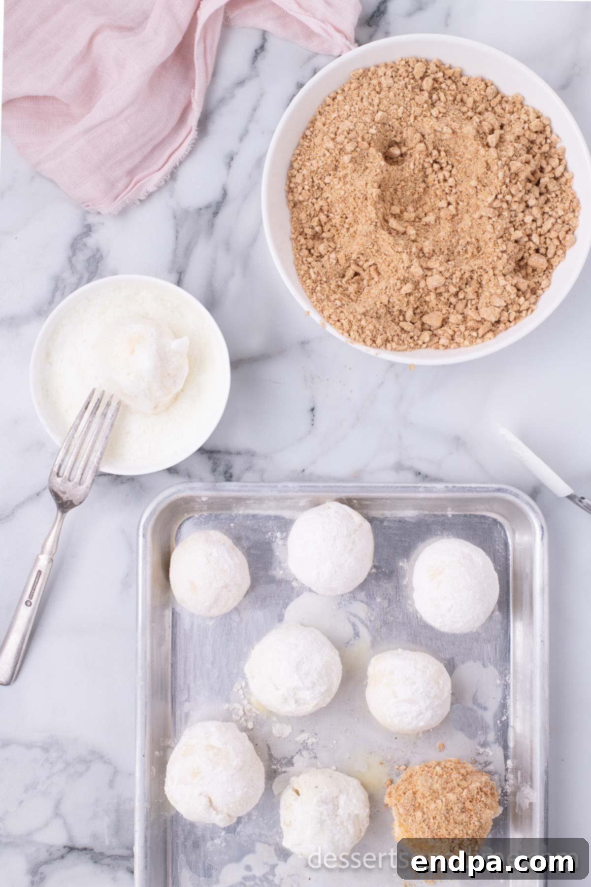 Ice cream balls coated in crushed Cinnamon Toast Crunch cereal.