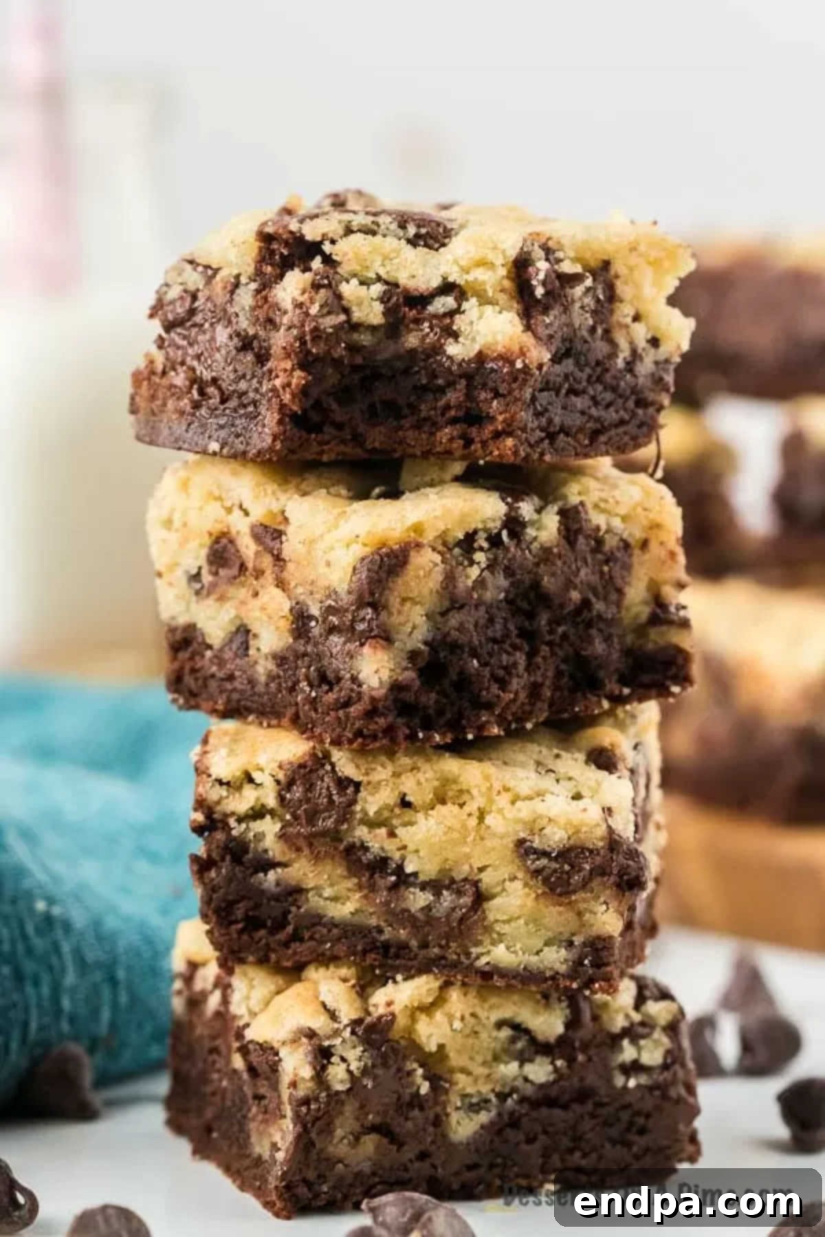 Perfectly cut squares of brookies arranged on a rustic wooden cutting board.