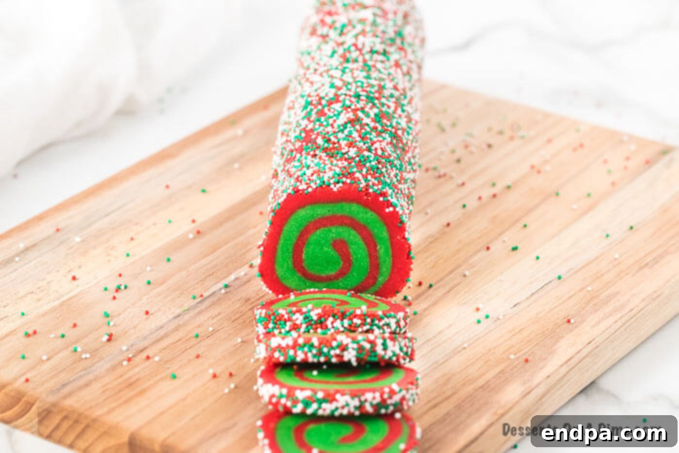 Chilled cookie dough log covered in sprinkles