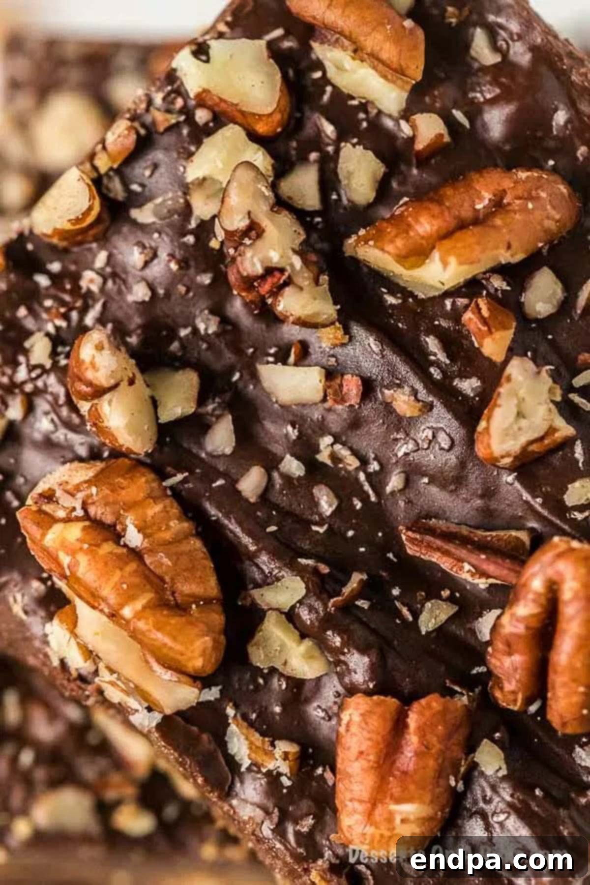 A close-up of Graham Cracker Toffee pieces, highlighting the texture and layers of chocolate and toffee.