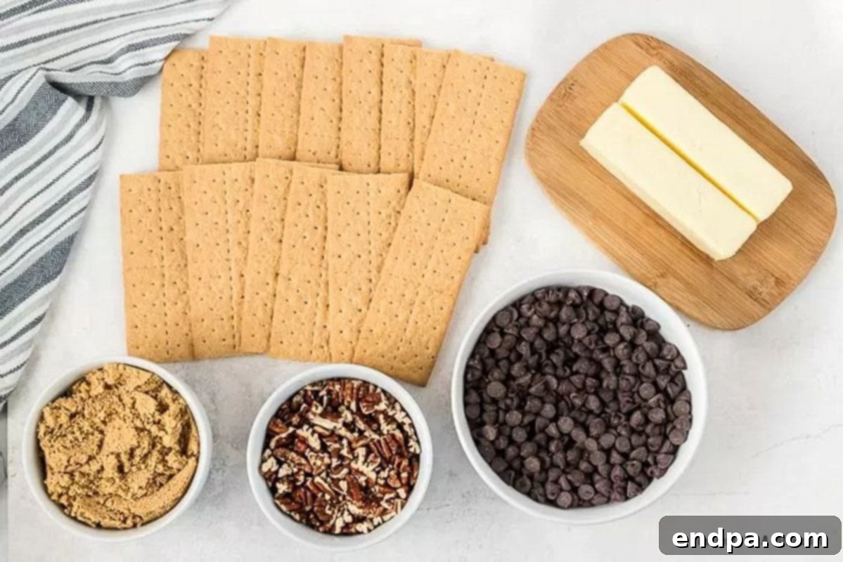 Ingredients needed for Graham Cracker Toffee: graham cracker sheets, butter, brown sugar, chocolate chips, and chopped pecans.