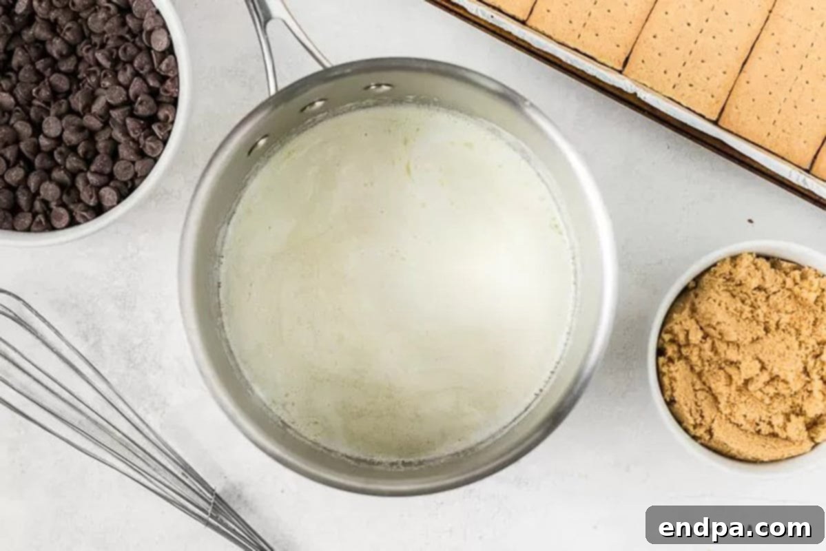 Brown sugar and butter melting together in a medium saucepan on the stovetop.