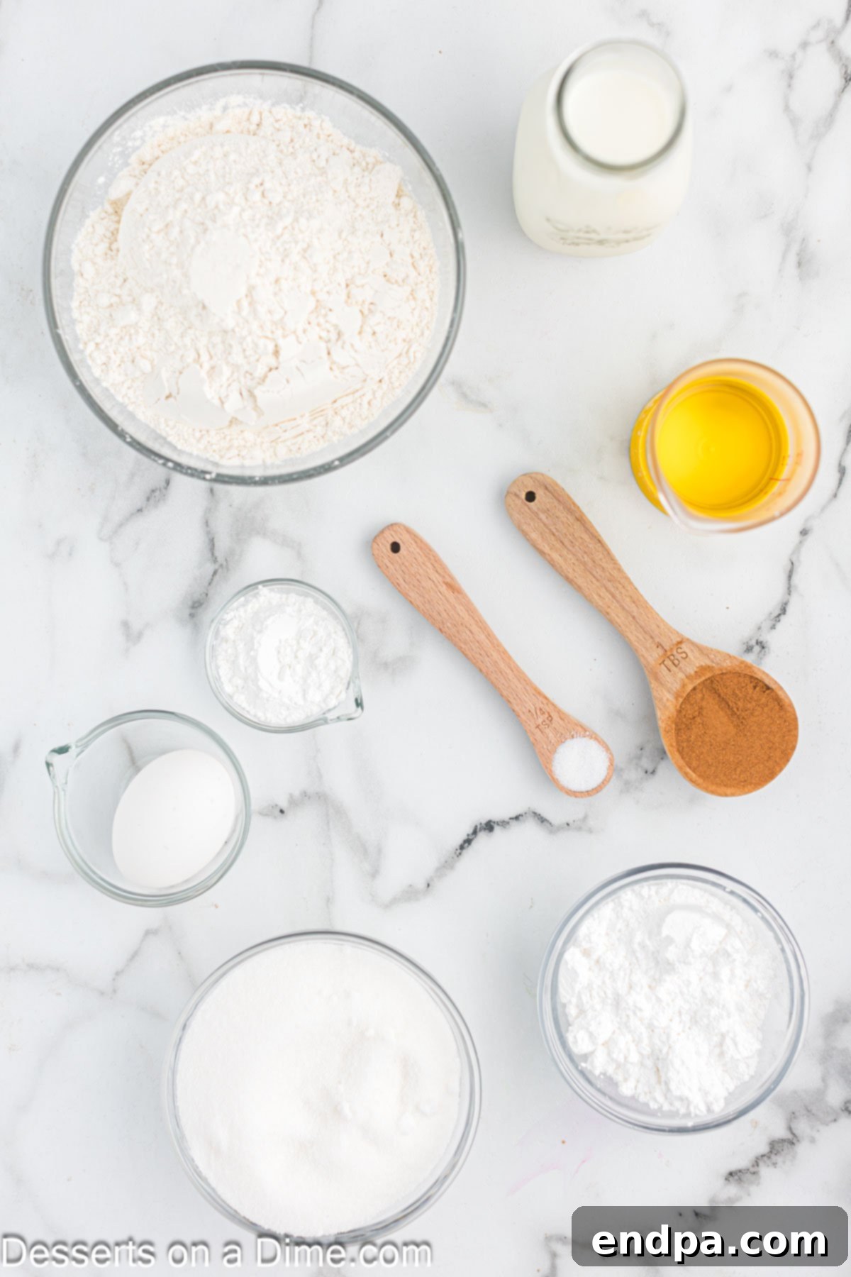 Ingredients for cinnamon bread - flour, sugar, baking powder, milk, oil, cinnamon, powdered sugar. 