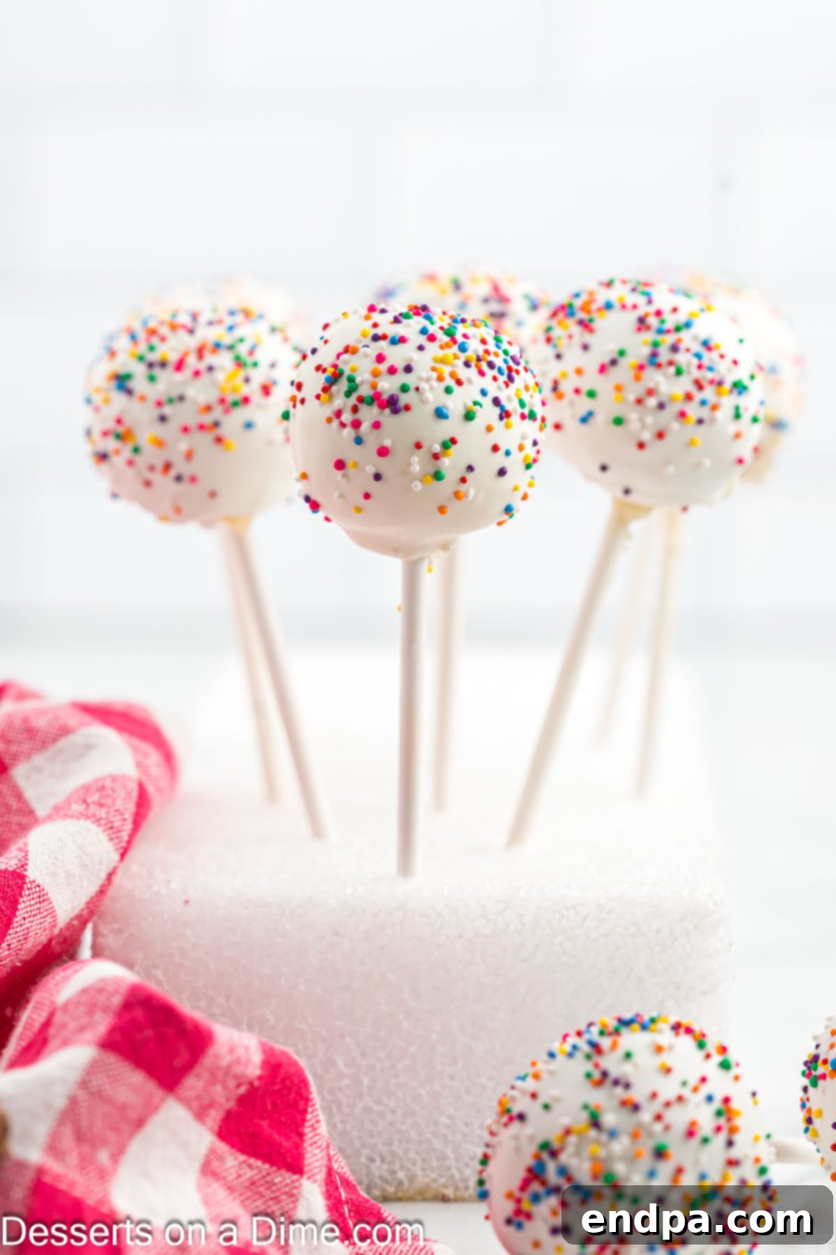 Whip Up Perfect Cake Pops 11 Finished cake pops drying in a block of Styrofoam.