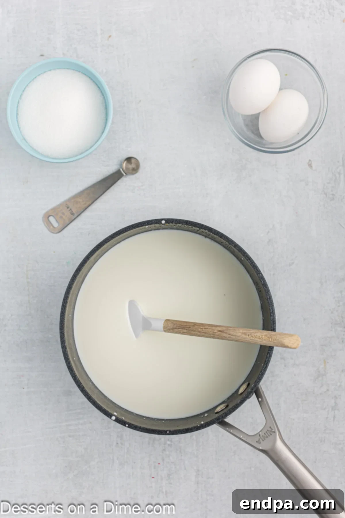 The saucepan now contains the plumped tapioca pearls, with whole milk and half and half just added, ready to be heated.
