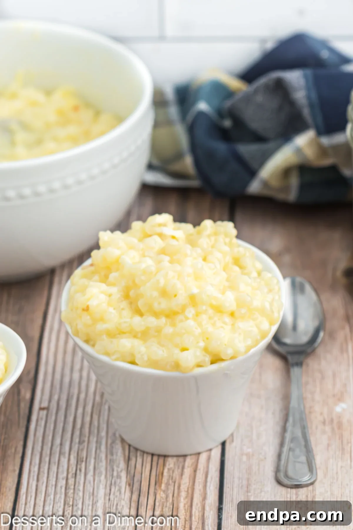 A serving of creamy homemade tapioca pudding in a simple white bowl, ready to be enjoyed.