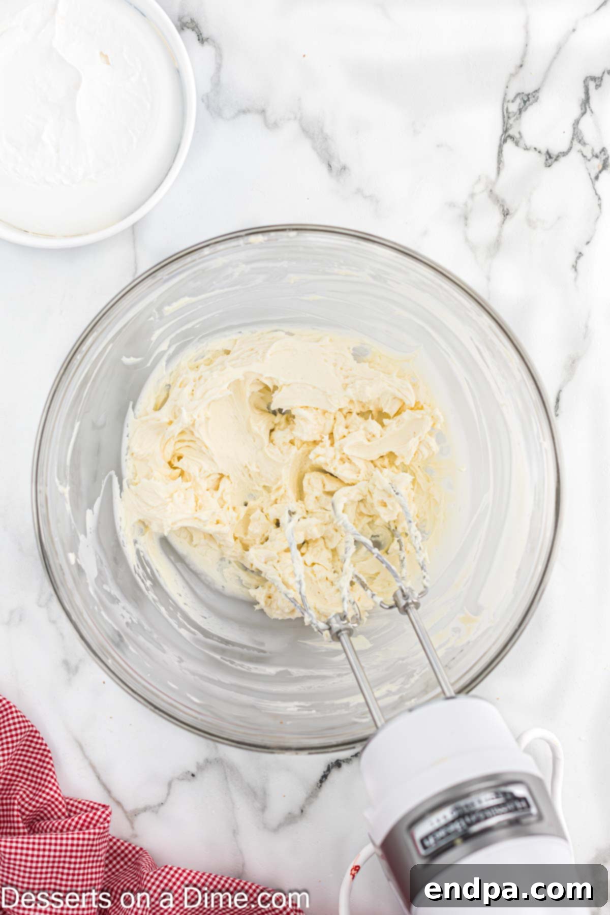 Filling in mixing bowl with an electric mixer.