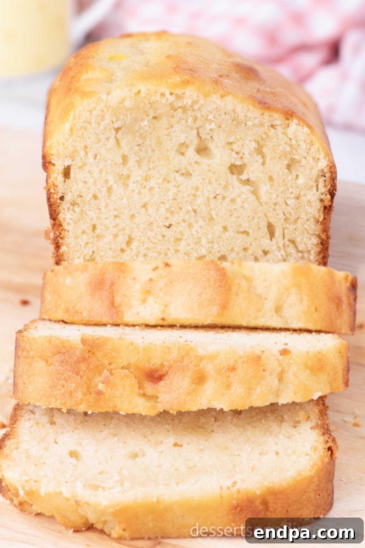 Sweet Bread cut into golden-brown slices, showcasing its moist texture, ready to be served for breakfast or a snack.
