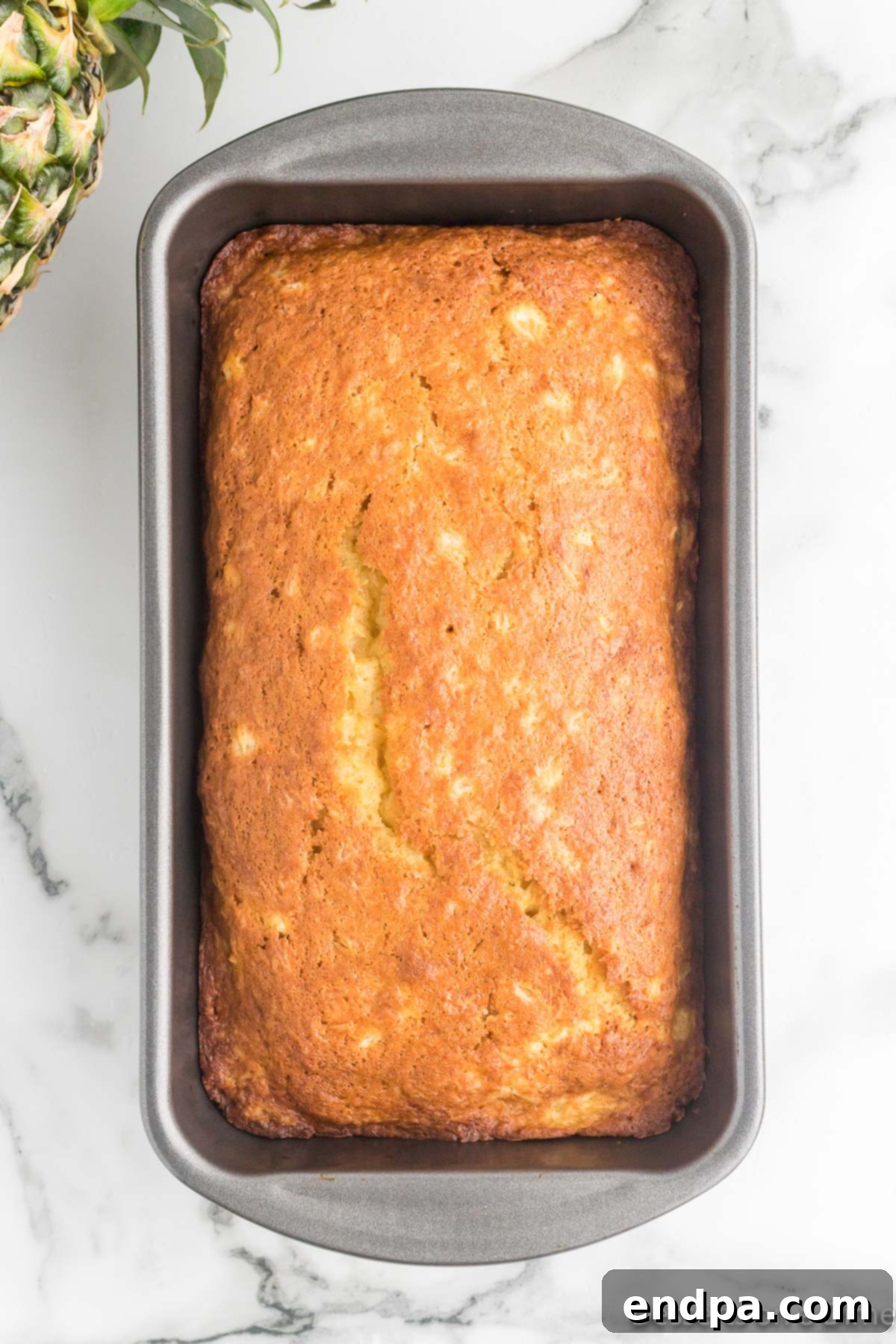 Grilled Pineapple Sweetbread 11 Bread in pan cooling.